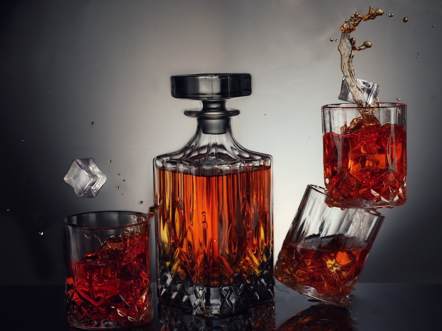 Cut-glass spirits decanter with filled tumblers