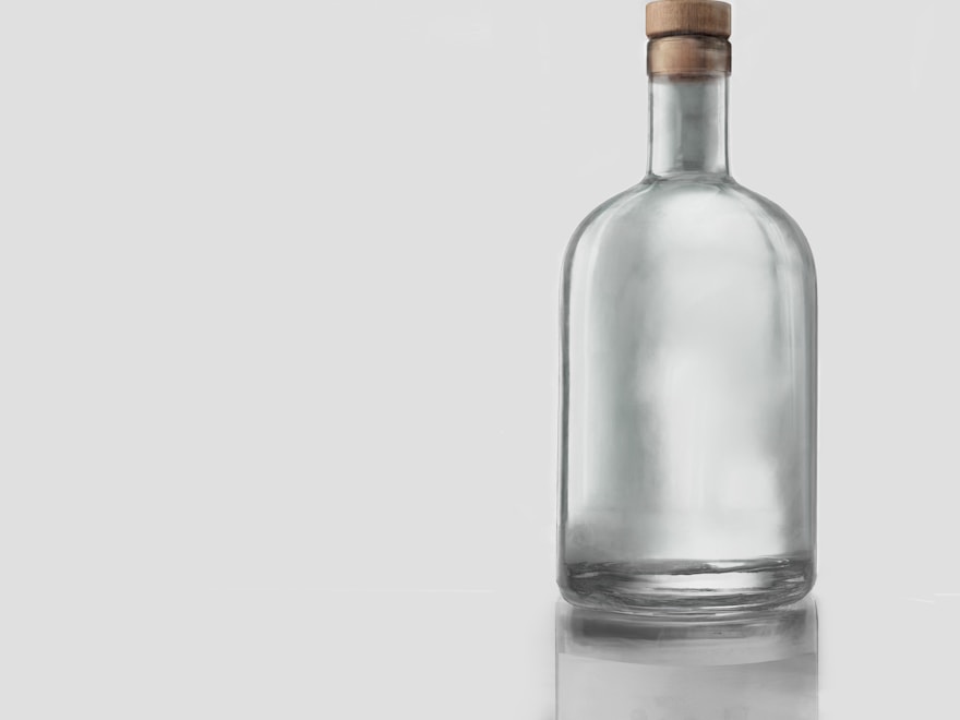 Clear flint glass spirits bottle with a wooden stopper