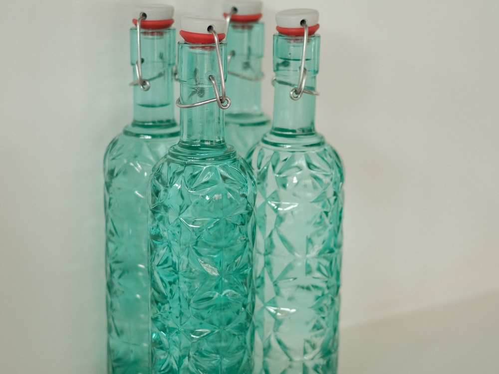 Glass bottles with a faceted diamond pattern embossed into the glass by the mold