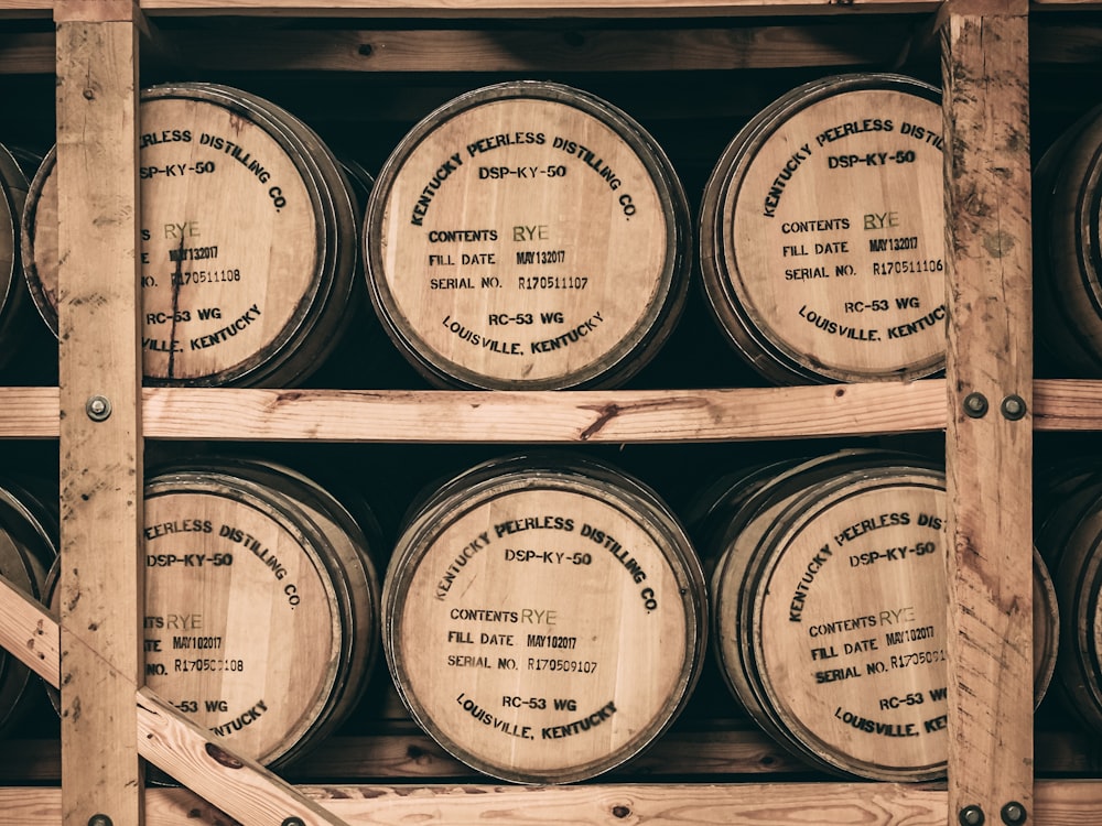 Rye whiskey barrels racked in a distillery