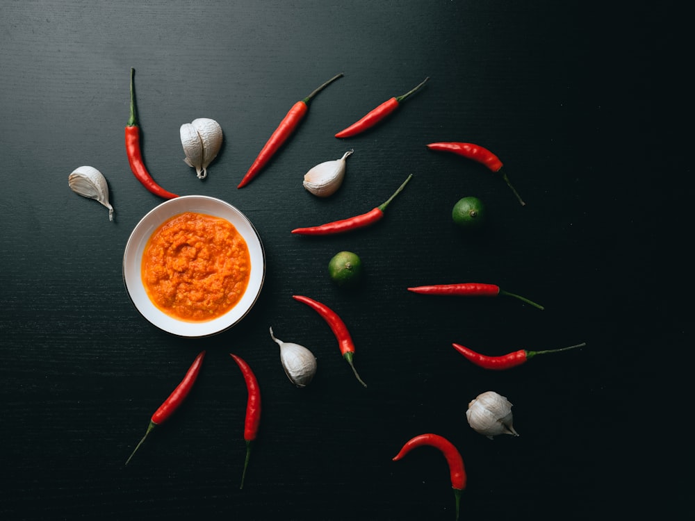 Chilis, garlic and fresh hot sauce styled on black