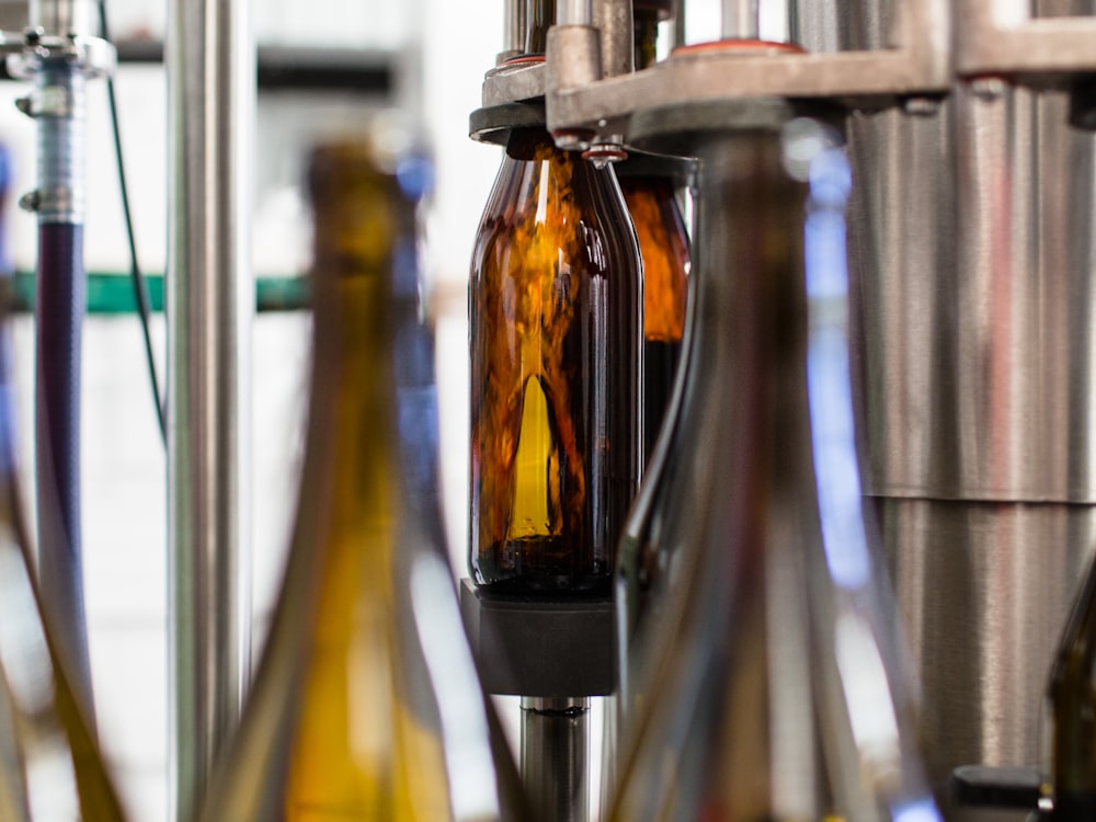 Amber glass bottles moving through a filling line